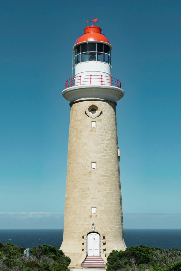 What are the best strategies for visiting the historic lighthouses along the UK coastline?